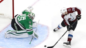 EDMONTON, ALBERTA - AUGUST 05: Nathan MacKinnon #29 of the Colorado Avalanche tries to get the puck past Anton Khudobin #35 of the Dallas Stars in the first period in a Western Conference Round Robin game during the 2020 NHL Stanley Cup Playoff at Rogers Place on August 05, 2020 in Edmonton, Alberta. (Photo by Jeff Vinnick/Getty Images)