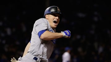CHICAGO, IL - OCTOBER 19: Enrique Hernandez #14 of the Los Angeles Dodgers celebrates after hitting a two-run home run in the ninth inning against the Chicago Cubs during game five of the National League Championship Series at Wrigley Field on October 19, 2017 in Chicago, Illinois. (Photo by Jamie Squire/Getty Images)