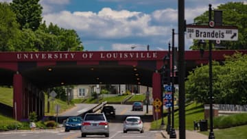 Traffic moves along East Brandeis Avenue on Tuesday on the University of Louisville campus. May 14, 2019T9i1025 Uofl Campus