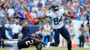 NASHVILLE, TN - SEPTEMBER 16: Corey Davis #84 of the Tennessee Titans is tackled by Johnathan Joseph #24 of the Houston Texans during the fourth quarter at Nissan Stadium on September 16, 2018 in Nashville, Tennessee. (Photo by Andy Lyons/Getty Images)