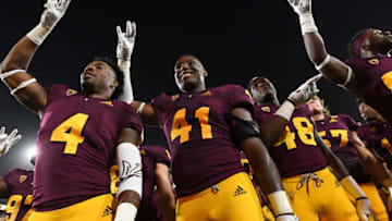 TEMPE, AZ - SEPTEMBER 01: Linebacker Koron Crump #4, defensive lineman Tyler Johnson #41 and safety Ely Doyle #48 of the Arizona State Sun Devils celebrate after defeating the UTSA Roadrunners at Sun Devil Stadium on September 1, 2018 in Tempe, Arizona. The Arizona State Sun Devils won 49-7. (Photo by Jennifer Stewart/Getty Images)