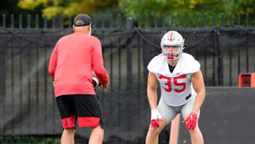 Aug 5, 2022; Columbus, OH, USA; Ohio State Buckeyes defensive coordinator Jim Knowles works with Ohio State Buckeyes linebacker Tommy Eichenberg (35) during practice at Woody Hayes Athletic Center in Columbus, Ohio on August 5, 2022.Ceb Osufb0805 Kwr 44