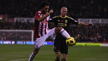 STOKE ON TRENT, ENGLAND - NOVEMBER 13: Paul Konchesky of Liverpool in action with Jermaine Pennant of Stoke City during the Barclays Premier League match between Stoke City and Liverpool at Britannia Stadium on November 13, 2010 in Stoke on Trent, England. (Photo by Clive Brunskill/Getty Images)