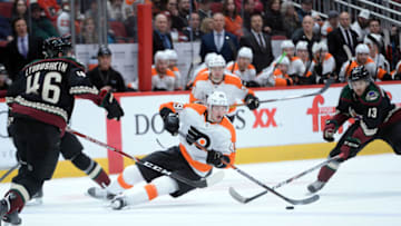 Jan 4, 2020; Glendale, Arizona, USA; Philadelphia Flyers left wing Joel Farabee (49) falls to the ice against the Arizona Coyotes during the third period at Gila River Arena. Mandatory Credit: Joe Camporeale-USA TODAY Sports