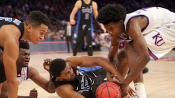 Nov 15, 2016; New York, NY, USA; Duke Blue Devils guard Matt Jones (13) and Kansas Jayhawks guard Josh Jackson (11) fight for a loose ball during the first half at Madison Square Garden. Mandatory Credit: Brad Penner-USA TODAY Sports