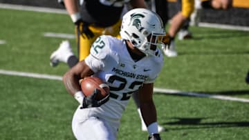Nov 7, 2020; Iowa City, Iowa, USA; Michigan State Spartans running back Jordon Simmons (22) runs the ball against the Iowa Hawkeyes during the third quarter at Kinnick Stadium. Mandatory Credit: Jeffrey Becker-USA TODAY Sports