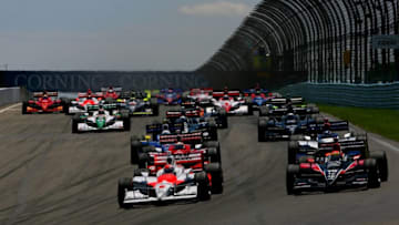 WATKINS GLEN, NY - JULY 05: Ryan Briscoe driving the #6 Team Penske Dallara Honda and Justin Wilson in the #18 Z-Line Design Dale Coyne Racing Dallara Honda lead the field into turn one at the start of the IRL IndyCar Series Camping World Grand Prix at The Glen on July 5, 2009 at the Watkins Glen International in Watkins Glen, New York. (Photo by Darrell Ingham/Getty Images)