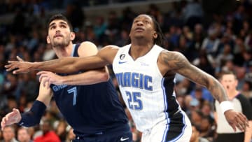 Mar 28, 2023; Memphis, Tennessee, USA; Memphis Grizzlies forward Santi Aldama (7) and Orlando Magic forward Admiral Schofield (25) battle for position during the second half at FedExForum. Mandatory Credit: Petre Thomas-USA TODAY Sports