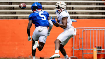 Florida Gators tight end Arlis Boardingham (8) makes a catch over Florida Gators safety Kamari Wilson (5) during fall football practice at Ben Hill Griffin Stadium at the University of Florida in Gainesville, FL on Saturday, August 5, 2023. [Matt Pendleton/Gainesville Sun]