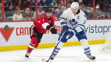 Feb 6, 2016; Ottawa, Ontario, CAN; Toronto Maple Leafs defenseman Dion Phaneuf (3) skates with the puck in front of Ottawa Senators center Kyle Turris (7) in the second period at the Canadian Tire Centre. Mandatory Credit: Marc DesRosiers-USA TODAY Sports