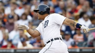 Jul 30, 2013; Detroit, MI, USA; Detroit Tigers third baseman Miguel Cabrera (24) hits a single in the first inning against the Washington Nationals at Comerica Park. Mandatory Credit: Rick Osentoski-USA TODAY Sports