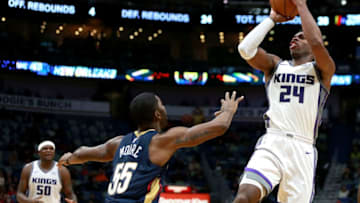 NEW ORLEANS, LA - DECEMBER 08: Buddy Hield #24 of the Sacramento Kings shoots over E'Twaun Moore during the second half of a NBA game at the Smoothie King Center on December 8, 2017 in New Orleans, Louisiana. the Sacramento Kings won the game in overtime 116 -109. NOTE TO USER: User expressly acknowledges and agrees that, by downloading and or using this photograph, User is consenting to the terms and conditions of the Getty Images License Agreement. (Photo by Sean Gardner/Getty Images)