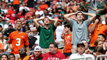 Sep 4, 2021; Atlanta, Georgia, USA; Miami Hurricanes fans react after Miami turned the ball over on downs during the third quarter against the Alabama Crimson Tide at Mercedes-Benz Stadium. Mandatory Credit: Jason Getz-USA TODAY Sports