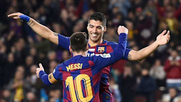 TOPSHOT - Barcelona's Argentine forward Lionel Messi celebrates his third goal with Barcelona's Uruguayan forward Luis Suarez during the Spanish League football match between FC Barcelona and RCD Mallorca at the Camp Nou stadium in Barcelona on December 7, 2019. (Photo by Josep LAGO / AFP) (Photo by JOSEP LAGO/AFP via Getty Images)