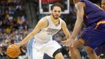 Feb 18, 2014; Denver, CO, USA; Denver Nuggets guard Evan Fournier (94) during the second half against the Phoenix Suns at Pepsi Center. The Suns won 112-107 in overtime. Mandatory Credit: Chris Humphreys-USA TODAY Sports