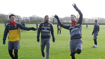 ST ALBANS, ENGLAND - JANUARY 13: Arsenal's (L) Mesut Ozil and (R) Shkodran Mustafi with ex player (2ndL) Robert Pires after a training session at London Colney on January 13, 2017 in St Albans, England. (Photo by Stuart MacFarlane/Arsenal FC via Getty Images)