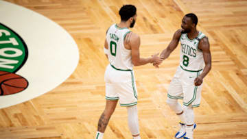 BOSTON, MASSACHUSETTS - MAY 18: Jayson Tatum #0 and Kemba Walker #8 of the Boston Celtics react during the second half of a game in the play-in tournament against the Washington Wizards at TD Garden on May 18, 2021 in Boston, Massachusetts. NOTE TO USER: User expressly acknowledges and agrees that, by downloading and or using this photograph, User is consenting to the terms and conditions of the Getty Images License Agreement. (Photo by Maddie Malhotra/Getty Images)