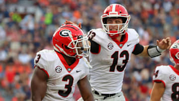 AUBURN, ALABAMA - OCTOBER 09: Zamir White #3 of the Georgia Bulldogs reacts after rushing for a touchdown against the Auburn Tigers with Stetson Bennett #13 during the second half at Jordan-Hare Stadium on October 09, 2021 in Auburn, Alabama. (Photo by Kevin C. Cox/Getty Images)