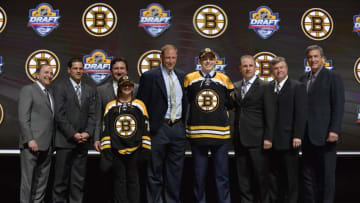 Jun 26, 2015; Sunrise, FL, USA; Jake Debrusk poses with team executives after being selected as the number fourteen overall pick to the Boston Bruins in the first round of the 2015 NHL Draft at BB&T Center. Mandatory Credit: Steve Mitchell-USA TODAY Sports