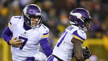 GREEN BAY, WI - DECEMBER 23: Case Keenum #7 hands the ball to Jerick McKinnon #21 of the Minnesota Vikings during the second half against the Green Bay Packers at Lambeau Field on December 23, 2017 in Green Bay, Wisconsin. The Vikings defeated the Packers 16-0. (Photo by Stacy Revere/Getty Images)