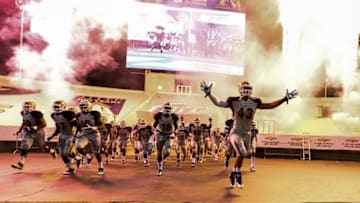 Sep 6, 2014; El Paso, TX, USA; UTEP defensive lineman Roy Robertson-Harris (43) and the rest of the Miners run on to the field before facing the Texas Tech Red Raiders at Sun Bowl Stadium. Mandatory Credit: Ivan Pierre Aguirre-USA TODAY Sports