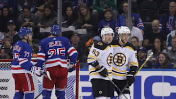 NEW YORK, NEW YORK - OCTOBER 27: Brad Marchand #63 of the Boston Bruins celebrates his goal at 1:08 of the second period against Henrik Lundqvist #30 of the New York Rangers and is joined by David Pastrnak #88 (R) at Madison Square Garden on October 27, 2019 in New York City. (Photo by Bruce Bennett/Getty Images)