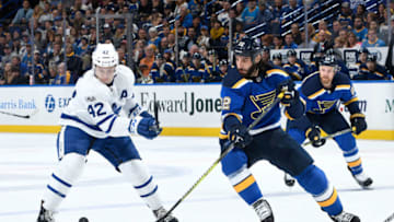 ST. LOUIS, MO - NOVEMBER 4: Tyler Bozak #42 of the Toronto Maple Leafs and Chris Thorburn #22 of the St. Louis Blues battle for the puck at Scottrade Center on November 4, 2017 in St. Louis, Missouri. (Photo by Scott Rovak/NHLI via Getty Images)