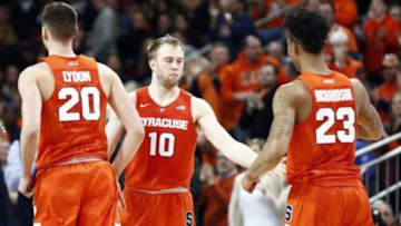 Feb 14, 2016; Chestnut Hill, MA, USA; Syracuse Orange guard Trevor Cooney (10), forward Tyler Lydon (20) and guard Malachi Richardson (23) celebrate against the Boston College Eagles during the second half at Silvio O. Conte Forum. Mandatory Credit: Mark L. Baer-USA TODAY Sports