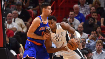 Dec 6, 2016; Miami, FL, USA; Miami Heat center Hassan Whiteside (21) drives the ball against New York Knicks center Willy Hernangomez (14) during the first half at American Airlines Arena. Mandatory Credit: Jasen Vinlove-USA TODAY Sports