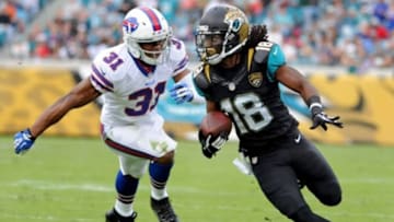 Dec 15, 2013; Jacksonville, FL, USA; Jacksonville Jaguars wide receiver Ace Sanders (18) runs the ball past Buffalo Bills free safety Jairus Byrd (31) during the first half at EverBank Field. Mandatory Credit: Melina Vastola-USA TODAY Sports