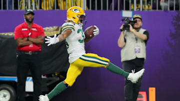 MINNEAPOLIS, MINNESOTA - DECEMBER 23: Running back Aaron Jones #33 of the Green Bay Packers rushes for a touchdown in the fourth quarter of the game against the Minnesota Vikings at U.S. Bank Stadium on December 23, 2019 in Minneapolis, Minnesota. (Photo by Adam Bettcher/Getty Images)