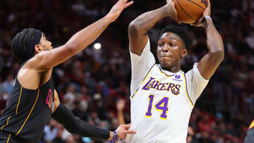 Stanley Johnson #14 of the Los Angeles Lakers passes around Gabe Vincent #2 of the Miami Heat(Photo by Michael Reaves/Getty Images)