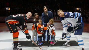 ANAHEIM, CA - JANUARY 25: Patrick Eaves #18 of the Anaheim Ducks participates in the pre-game puck drop ceremony with his kids along with Blake Wheeler #26 of the Winnipeg Jets and teammate Ryan Getzlaf #15 on January 25, 2018 at Honda Center in Anaheim, California. (Photo by Debora Robinson/NHLI via Getty Images)