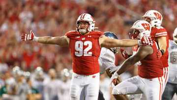 Sep 11, 2021; Madison, Wisconsin, USA; Wisconsin Badgers defensive end Matt Henningsen (92) celebrates after sacking Eastern Michigan Eagles quarterback Ben Bryant (8) (not pictured) during the second quarter at Camp Randall Stadium. Mandatory Credit: Jeff Hanisch-USA TODAY Sports
