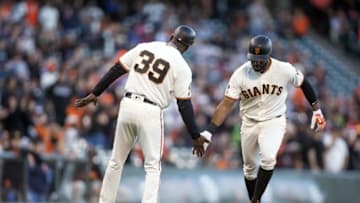 Jun 13, 2016; San Francisco, CA, USA; San Francisco Giants center fielder Denard Span (2) is congratulated by San Francisco Giants third base coach Roberto Kelly (39) rounding third base after hitting a home run in the first inning against the Milwaukee Brewers at AT&T Park. Mandatory Credit: Neville E. Guard-USA TODAY Sports