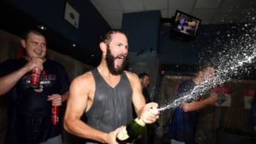 Oct 7, 2015; Pittsburgh, PA, USA; Chicago Cubs starting pitcher Jake Arrieta (49) celebrates in the locker room after defeating the Pittsburgh Pirates in the National League Wild Card playoff baseball game at PNC Park. Cubs won 4-0. Mandatory Credit: Charles LeClaire-USA TODAY Sports