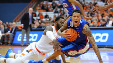 Dec 14, 2014; Syracuse, NY, USA; Louisiana Tech Bulldogs forward Michale Kyser (1) is knocked to the floor by Syracuse Orange forward Rakeem Christmas (25) during the first half at the Carrier Dome. Mandatory Credit: Rich Barnes-USA TODAY Sports