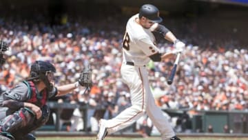 Jul 9, 2016; San Francisco, CA, USA; San Francisco Giants second baseman Grant Green (38) hits a two run home run in the fourth inning in front of Arizona Diamondbacks catcher Tuffy Gosewisch (8) at AT&T Park. Mandatory Credit: Neville E. Guard-USA TODAY Sports