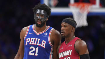 Joel Embiid #21 of the Philadelphia 76ers talks to Jimmy Butler #22 of the Miami Heat(Photo by Mitchell Leff/Getty Images)