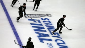 BOSTON, MA - MAY 23: Boston Bruins players skate around the Stanley Cup logo on the ice during warmups before a scrimmage ahead of the start of the 2019 NHL Stanley Cup Finals at TD Garden in Boston on May 23, 2019. (Photo by John Tlumacki/The Boston Globe via Getty Images)
