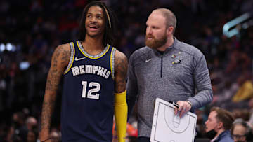 DETROIT, MICHIGAN - FEBRUARY 10: Ja Morant #12 of the Memphis Grizzlies talks with head coach Taylor Jenkins while playing the Detroit Pistons at Little Caesars Arena on February 10, 2022 in Detroit, Michigan. The Memphis Grizzlies won the game 132-107. (Photo by Gregory Shamus/Getty Images)