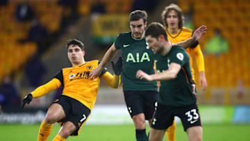WOLVERHAMPTON, ENGLAND - DECEMBER 27: Wolverhampton Wanderers is challenged by Harry Winks of Tottenham Hotspur during the Premier League. (Photo by Michael Steele/Getty Images)