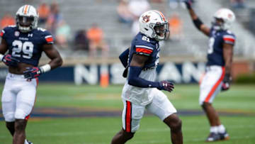 Auburn football safety Smoke Monday (21) celebrates after making a quick stop during Auburn football A-Day spring game at Jordan-Hare Stadium in Auburn, Ala., on Saturday, April 17, 2021.
