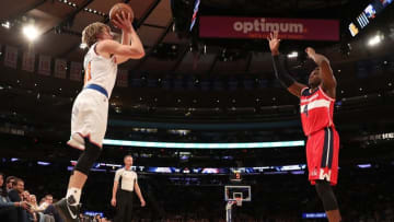 Oct 10, 2016; New York, NY, USA; New York Knicks guard Ron Baker (31) shoots the ball over Washington Wizards guard Daniel House (4) during the third quarter at Madison Square Garden. The Knicks won 90-88. Mandatory Credit: Anthony Gruppuso-USA TODAY Sports