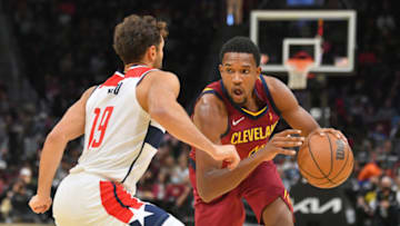 CLEVELAND, OHIO - NOVEMBER 10: Raul Neto #19 of the Washington Wizards tries to guard Evan Mobley #4 of the Cleveland Cavaliers during the second half at Rocket Mortgage Fieldhouse on November 10, 2021 in Cleveland, Ohio. The Wizards defeated the Cavaliers 97-94. NOTE TO USER: User expressly acknowledges and agrees that, by downloading and/or using this photograph, user is consenting to the terms and conditions of the Getty Images License Agreement. (Photo by Jason Miller/Getty Images)