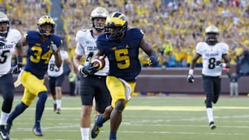 Sep 17, 2016; Ann Arbor, MI, USA; Michigan Wolverines linebacker Jabrill Peppers (5) runs the ball in the second half against the Colorado Buffaloes at Michigan Stadium. Michigan won 45-28. Mandatory Credit: Rick Osentoski-USA TODAY Sports