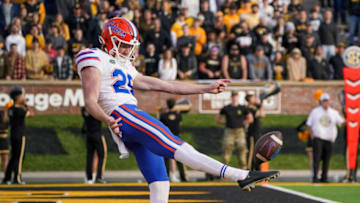 Nov 20, 2021; Columbia, Missouri, USA; Florida Gators punter Jeremy Crawshaw (26) punts out of the end zone against the Missouri Tigers during the first half at Faurot Field at Memorial Stadium. Mandatory Credit: Denny Medley-USA TODAY Sports