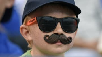 KANSAS CITY, MO - MAY 16 14: A young New York Yankees fan watches the Yankees play against the Kansas City Royals in the third inning at Kauffman Stadium on May 16, 2014 in Kansas City, Missouri. (Photo by Ed Zurga/Getty Images)