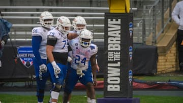 Auburn footballDec 31, 2020; Fort Worth, TX, USA; Tulsa Golden Hurricane quarterback Zach Smith (11) and running back Corey Taylor II (24) and offensive lineman Jaden Muskrat (79) and offensive lineman Tyler Smith (56) celebrate a touchdown against the Mississippi State Bulldogs during the second half at Amon G. Carter Stadium. Mandatory Credit: Jerome Miron-USA TODAY Sports