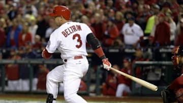 Oct 27, 2013; St. Louis, MO, USA; St. Louis Cardinals right fielder Carlos Beltran (3) hits a RBI single against the Boston Red Sox in the third inning during game four of the MLB baseball World Series at Busch Stadium. Mandatory Credit: H.Darr Beiser-USA TODAY Sports